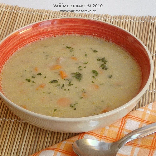 Hot healthy celery soup in a red-rimmed bowl.