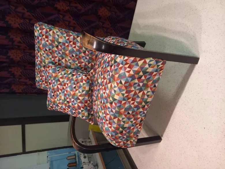 Upholstered chair with geometric fabric pattern
